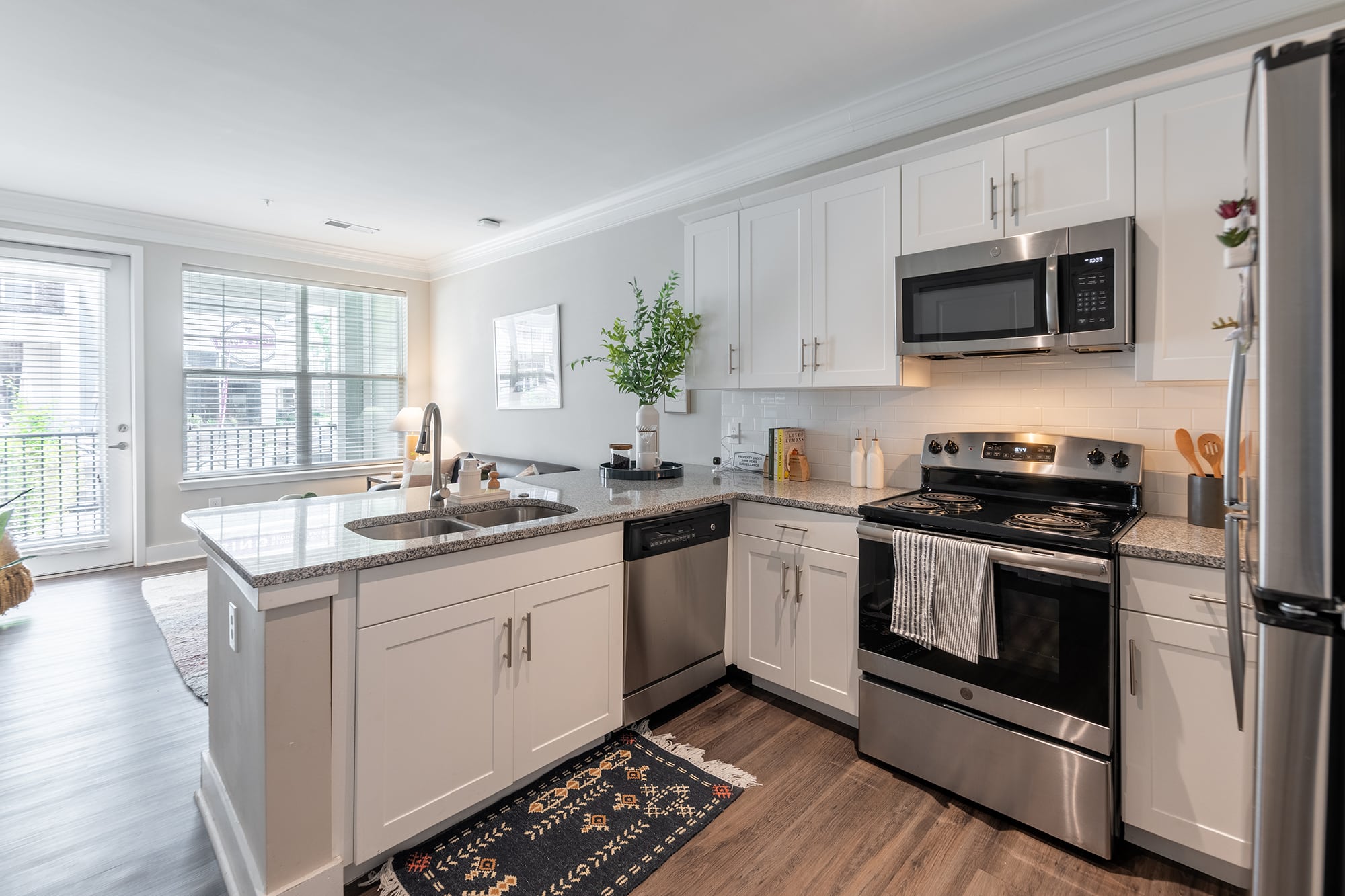 quantum on west call off campus apartments near florida state university kitchen and living room